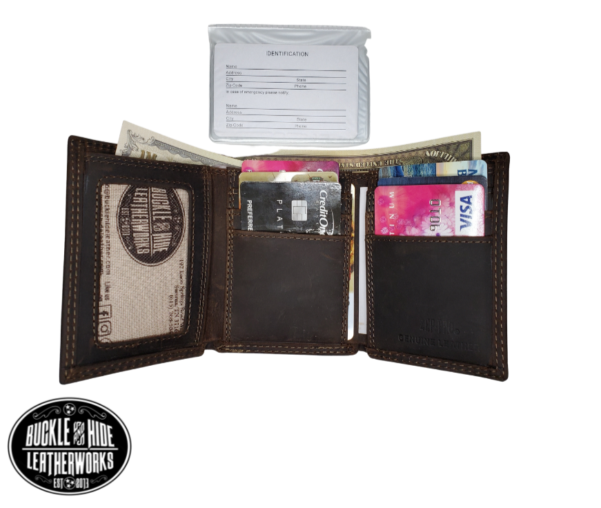 Distressed Brown tri-fold wallet with a Antique nickel oval concho with your choice of your favorite team Features... 2 large cash pockets, 6 card slots, 2 pockets under the card pockets, 1 I.D. slot, 1 Clear ID/picture/card holder Ships in Tin gift box See our other wallets with your favorite College Sports teams Imported Sold online or in our shop in Smyrna, TN, just outside of Nashville