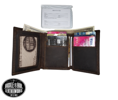 Distressed Brown tri-fold wallet with a Antique nickel oval concho with your choice of your favorite team Features... 2 large cash pockets, 6 card slots, 2 pockets under the card pockets, 1 I.D. slot, 1 Clear ID/picture/card holder Ships in Tin gift box See our other wallets with your favorite College Sports teams Imported Sold online or in our shop in Smyrna, TN, just outside of Nashville