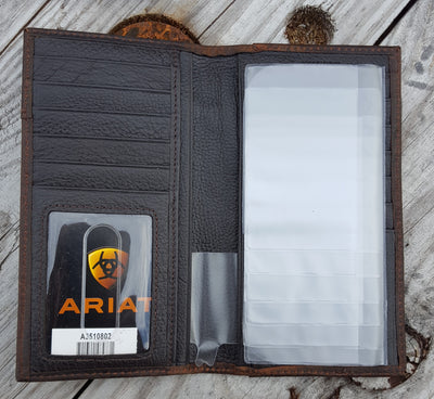 Ariate wallet inside view Ariat Rodeo style wallet Wallet is distressed brown leather with Ariat shield concho and Western style stitching Multiple credit card slots, clear driver's license slot and removable picture holder. Folded wallet measures 7" tall by 3" wide Interior has twelve card slots, one open cash pocket, and an identification window plus removable clear plastic picture holder.