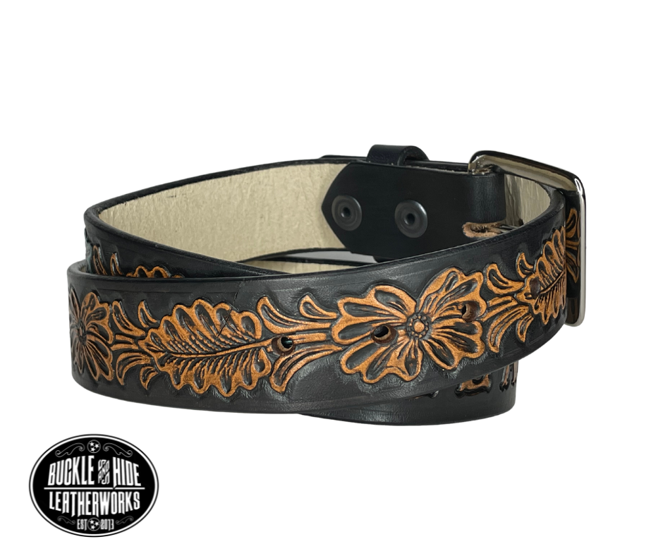 "The Desperado" is a handmade real leather belt made from a single strip of cowhide shoulder leather that is 8-10 oz. or approx. 1/8" thick. It has hand burnished (smoothed) edges and the Classic Western pattern. This belt is completely HAND dyed with a multi step finishing/painting technic. The antique nickel plated solid brass buckle is snapped in place with heavy snaps.  This belt is made just outside Nashville in Smyrna, TN.