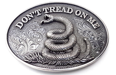 Oval shaped Nocona buckle Smooth edge and "Don't Tread On Me" motif Measures 2 1/2" tall by 3 1/2" wide Made in Taiwan Available online and in our shop in Smyrna, TN, just outside of Nashville