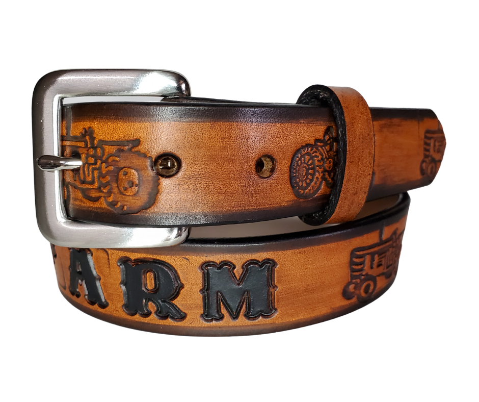 Our Lil Ferguson is just like the Ferguson for dad or mom. Full grain American vegetable tanned cowhide approx. 1/8"thick. Width is 1 1/4" and includes Antique Nickle plated Solid Brass buckle. We Hand Finished with a darker brown edge feathered into a tan center. Edges are smooth burnished painted edges. Made in our Smyrna, TN, USA shop. Buckle snaps in place for easy changing if desired. 