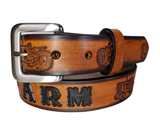 Our Lil Ferguson is just like the Ferguson for dad or mom. Full grain American vegetable tanned cowhide approx. 1/8"thick. Width is 1 1/4" and includes Antique Nickle plated Solid Brass buckle. We Hand Finished with a darker brown edge feathered into a tan center. Edges are smooth burnished painted edges. Made in our Smyrna, TN, USA shop. Buckle snaps in place for easy changing if desired. 