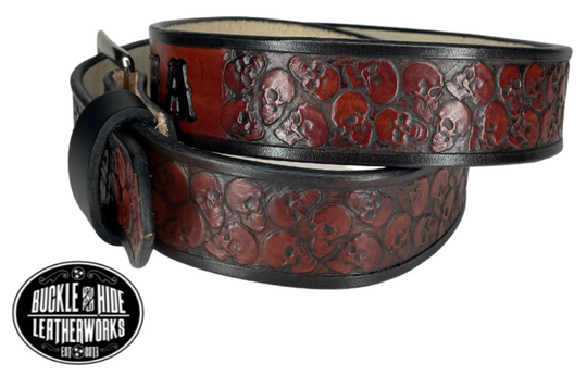 "The Forsaken" is a handmade real leather belt made from a single strip of cowhide shoulder leather that is 8-10 oz. or approx. 1/8" thick. It has hand burnished (smoothed) edges and the Serpent pattern embossed on the surface. The antique nickel plated solid brass buckle is snapped in place with heavy snaps.  This belt is made just outside Nashville in Smyrna, TN. Belt width is 1 1/2". side view
