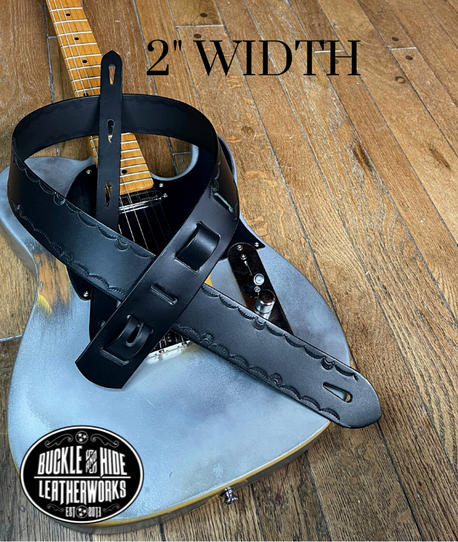 We dressed this up just a bit with a Border design versus "the CASH". It's made from 1/8" thick drum dyed vegetable tanned cow hide and has a smooth, glossy finish.  The main strap is made from a single strip of leather with beveled and painted edges.  Choose a 2" or 2 1/2" wide strap with a classic adjustment style. Made just outside Nashville in Smyrna, TN.