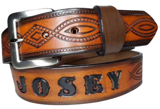 "The Good, Bad, and the Ugly" is a professionally crafted, genuine leather belt made from 8-10 oz cowhide shoulder leather, approximately 1/8" thick. It boasts a hand burnished edge, Diamond center, and rope edge pattern, along with a multi-step dye and finishing technique. The antique nickel plated solid brass buckle is affixed with heavy snaps. This belt is crafted near Nashville, TN in Smyrna.