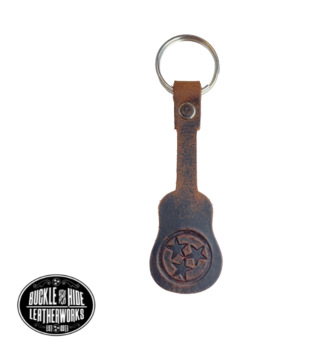 Brown distressed leather keychain in the shape of a guitar embossed with popular Tennessee Tristar logo. Great gift for music lover in your family. BUY MORE and SAVE! Made in our local shop in Smyrna, TN, just outside of Nashville.