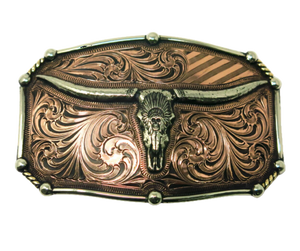 The Chief Longhorn buckle  These buckles are made from German Silver (nickel and brass alloy) or iron metal base. Some buckles have motifs made of copper, iron or brass and some are adorned with synthetic stones. These are all handcrafted. Each piece is punched, cut, soldered, engraved, polished and painted by our talented metal workers.  Available in our Smyrna TN shop.