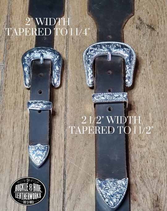 You don't get more classic than a handcrafted Distressed leather guitar strap! Featuring a ornate 3 piece western buckle set in the front position of the strap. Each size of buckle set is similar but not the same, so check out pictures. It's made from 1/8" thick drum distressed water buffalo and looks like a vintage "Tele". The main strap is made from a single strip of leather with beveled and .  Choose a 2" or 2 1/2" wide strap with a classic adjustment style.  Made just outside Nashville in Smyrna, TN.