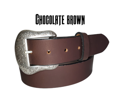 "The Sheridan" named after the well known town in Wyoming. The buckle has a Western Scroll pattern in a antique silver color that is right at home on the Ranch or Downtown, Belt is a solid strip of leather and made in our shop in Smyrna, TN, just outside of Nashville. Belt is 1 1/2" wide, choose from either distressed brown, black, or chocolate brown. Sizes available from 34"-44". Buckle is imported. Available in our retail and online shops.