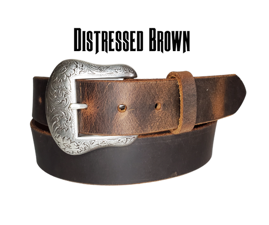 "The Sheridan" named after the well known town in Wyoming. The buckle has a Western Scroll pattern in a antique silver color that is right at home on the Ranch or Downtown, Belt is a solid strip of leather and made in our shop in Smyrna, TN, just outside of Nashville. Belt is 1 1/2" wide, choose from either distressed brown, black, or chocolate brown. Sizes available from 34"-44". Buckle is imported. Available in our retail and online shops.
