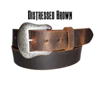 "The Sheridan" named after the well known town in Wyoming. The buckle has a Western Scroll pattern in a antique silver color that is right at home on the Ranch or Downtown, Belt is a solid strip of leather and made in our shop in Smyrna, TN, just outside of Nashville. Belt is 1 1/2" wide, choose from either distressed brown, black, or chocolate brown. Sizes available from 34"-44". Buckle is imported. Available in our retail and online shops.