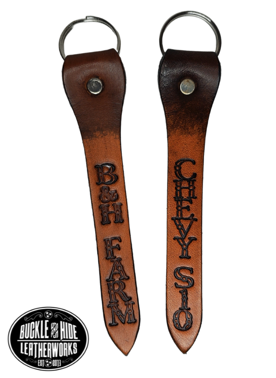 Our Leather keychain embossed similar to our popular belts.  Add your name MAXIMUM OF 8 LETTERS! Great for identifying luggage, backpacks, or you keys! Available in the below choices All colored in our popular 2 TONE BROWN, pick one or a few. Made in our Smyrna Tn. shop.