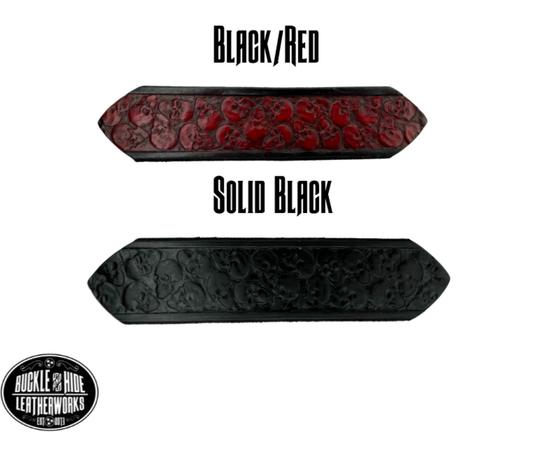"The Forsaken" is a handmade real leather belt made from a single strip of cowhide shoulder leather that is 8-10 oz. or approx. 1/8" thick. It has hand burnished (smoothed) edges and the Serpent pattern embossed on the surface. The antique nickel plated solid brass buckle is snapped in place with heavy snaps.  This belt is made just outside Nashville in Smyrna, TN. Belt width is 1 1/2". Color options black/red and solid black