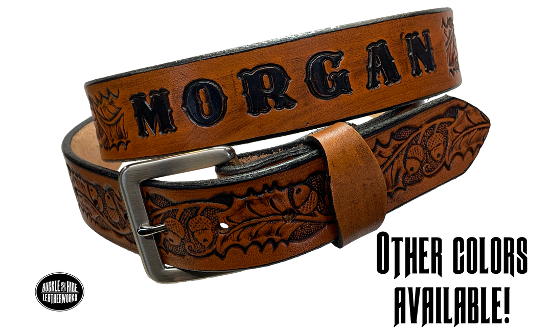 The Tall Oak Name Leather Belt is crafted from strong, high-quality Veg tan leather with an embossed Oak and Acorn pattern. Choose your finish and a name if desired. Its solid Antique nickel brass buckle is easy to change with included snaps, perfect for everyday wear. Handmade outside of Nashville in Smyrna, TN.