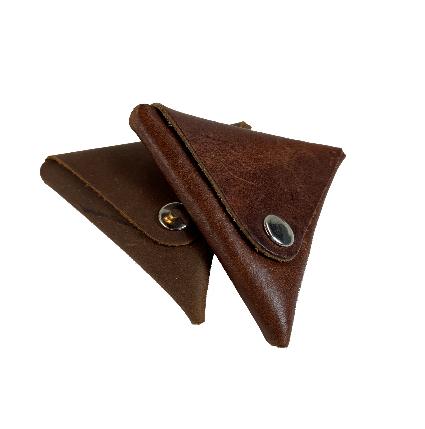 Handmade leather 2 sided coin wallet in shape of triangle with 2 silver colored snap closures on both flat sides so that coins and other small items may be carried.  Fits in the palm of the hand.  Available in either assorted brown or black leather.  Made in USA